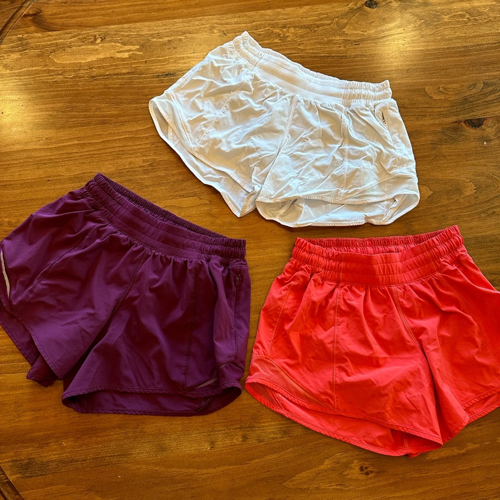 3 pairs of Lululemon hotty hot low rise lined shorts